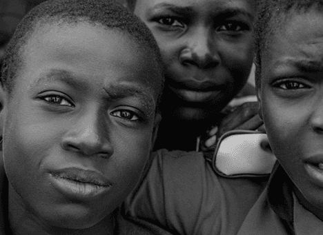 Black-and-white portrait of three boys
