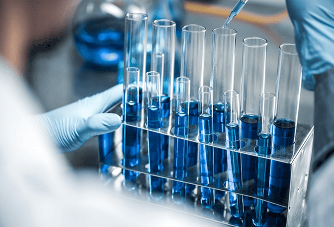 Blue test tubes in a laboratory rack